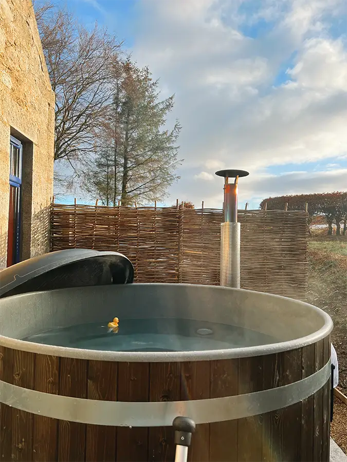 Wood-fired hot tub at Boutique Farm Bothies — evenings on the farm after a distillery day