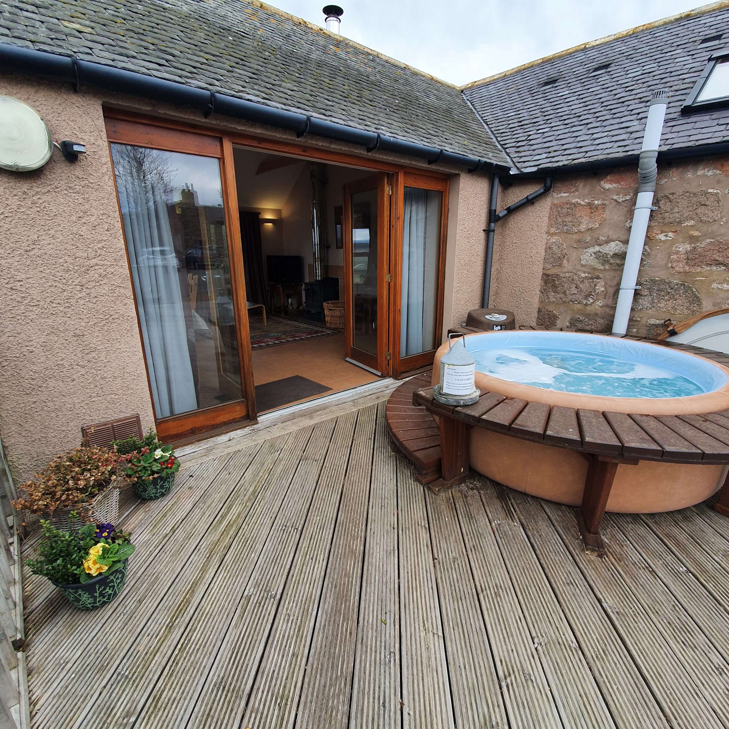 Hot tub on the Bothy at Cairnton Farm Cottages, looking over the Deeside farmland