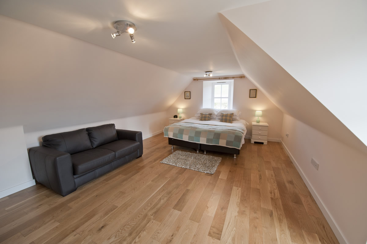King Duncan's View — floor-to-ceiling windows, leather sofas, steading conversion